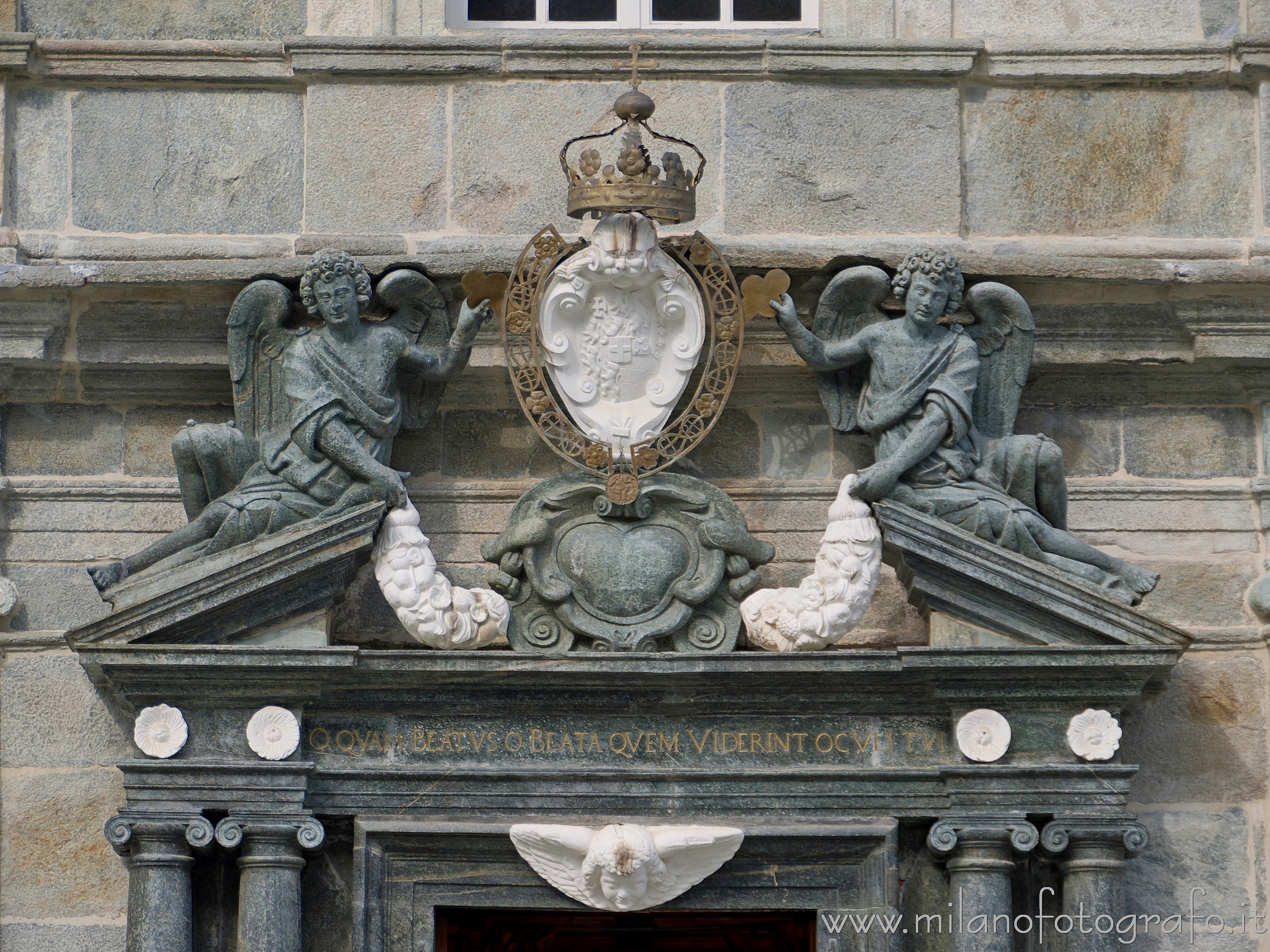 Biella (Italy) - Fronton of the door  of the Ancient Basilica of the Santuary of Oropa